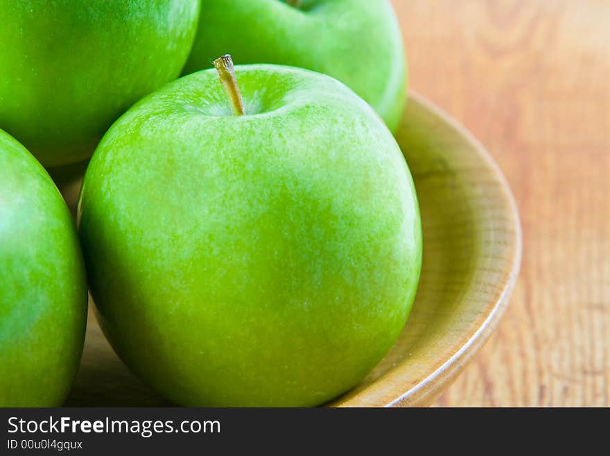 Four green apples