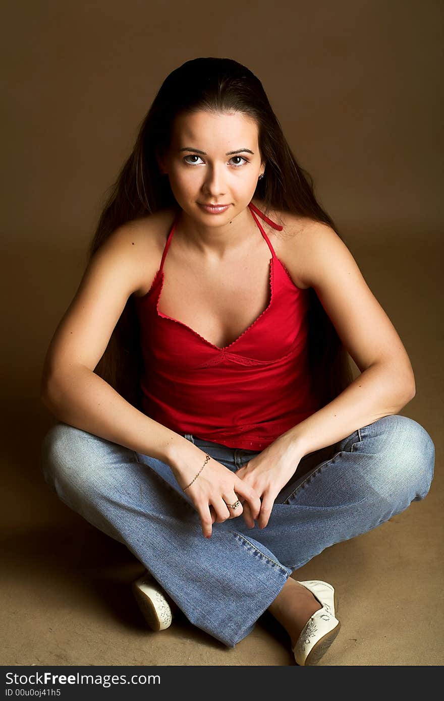 Girl in jeans and red top with long hair. Girl in jeans and red top with long hair