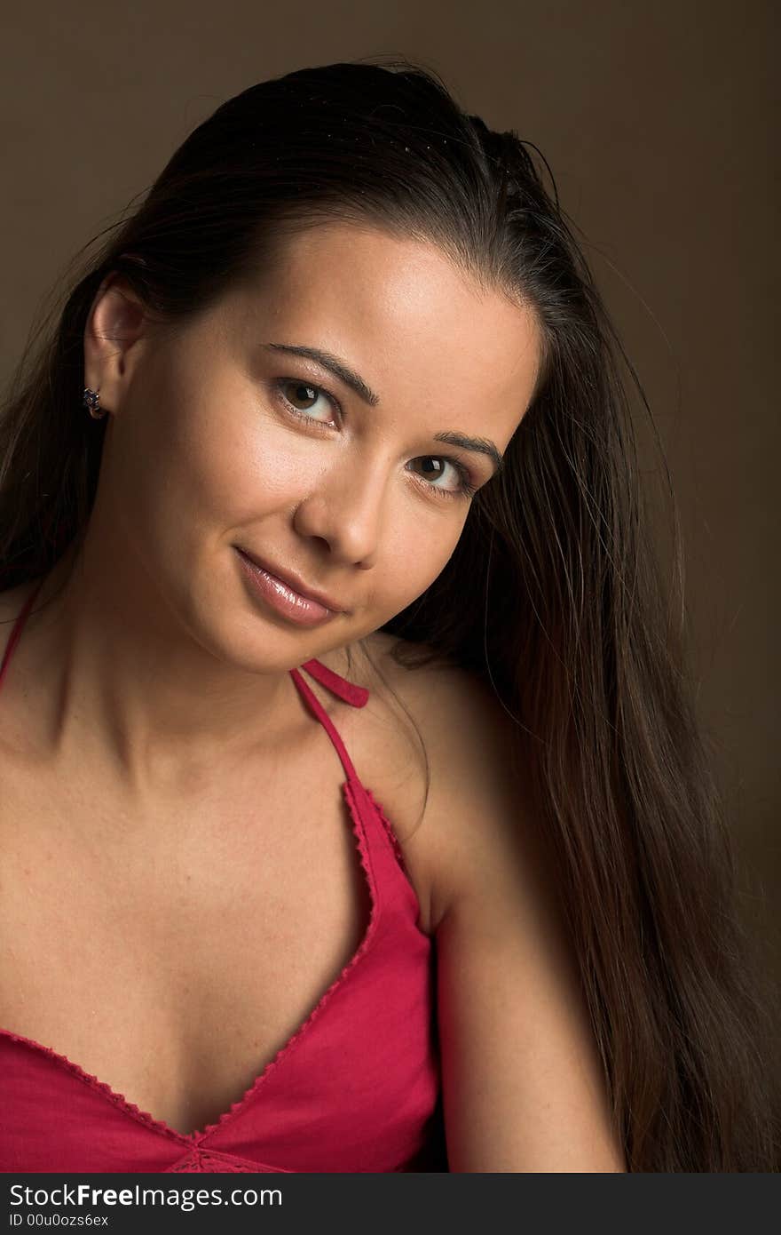 Close-up portrait of a girl in red top with long hair. Close-up portrait of a girl in red top with long hair