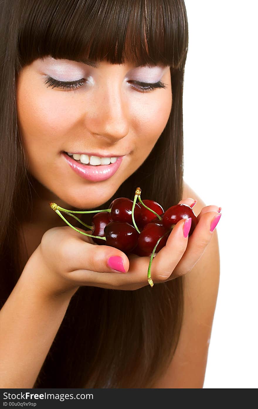 Brunette holding cherries, close-up portrait, isolated on white background