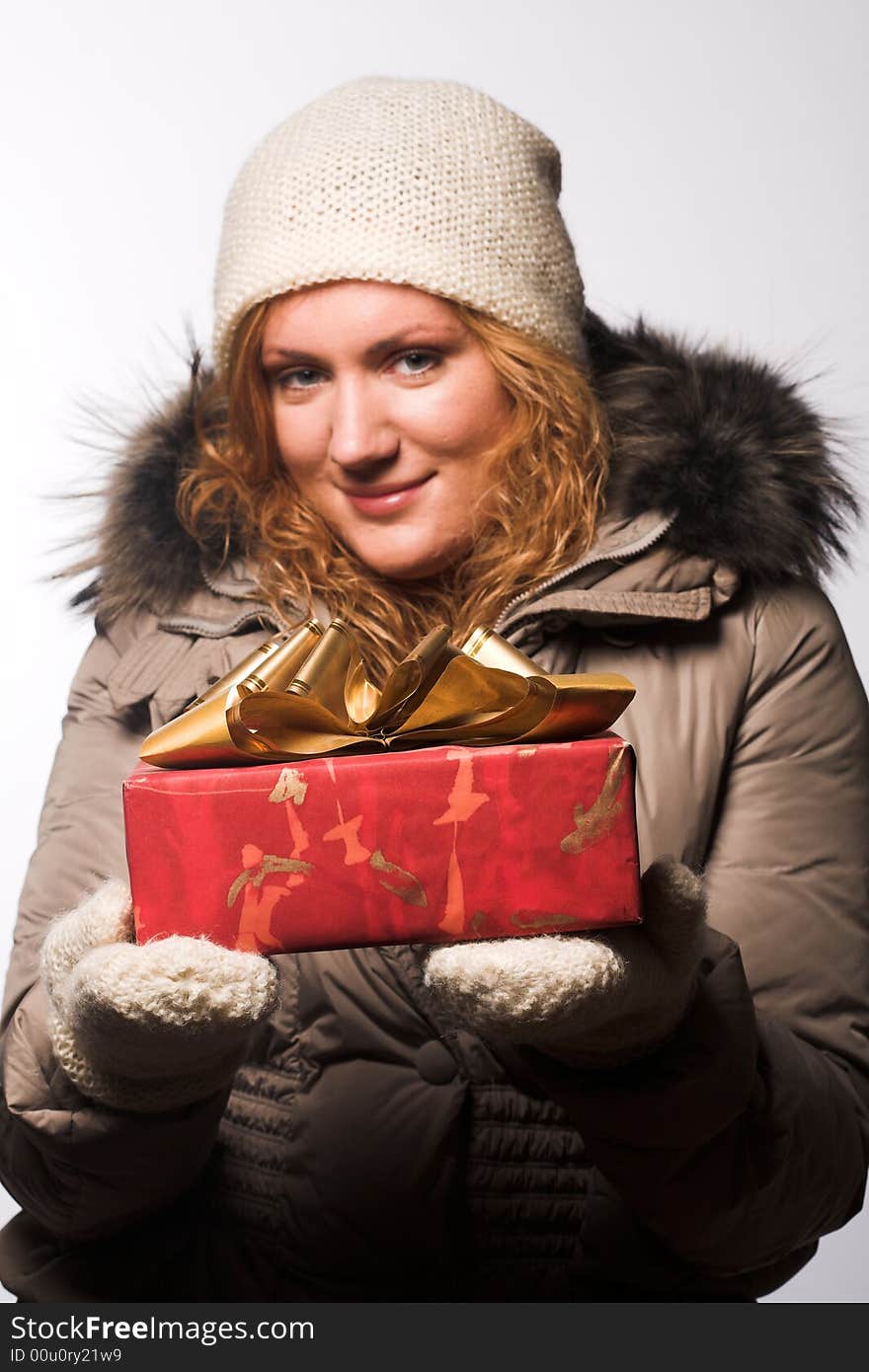 Woman offering a christmas gift