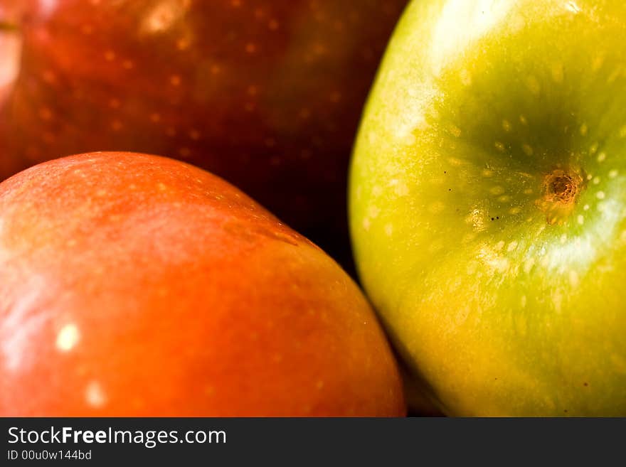 Macro shot of fresh ripe apples washed with water