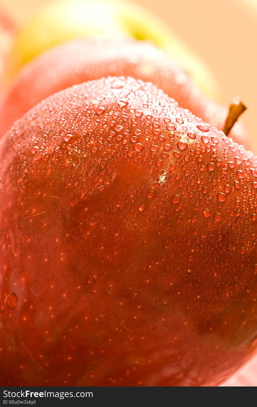 Macro shot of fresh ripe apples washed with water