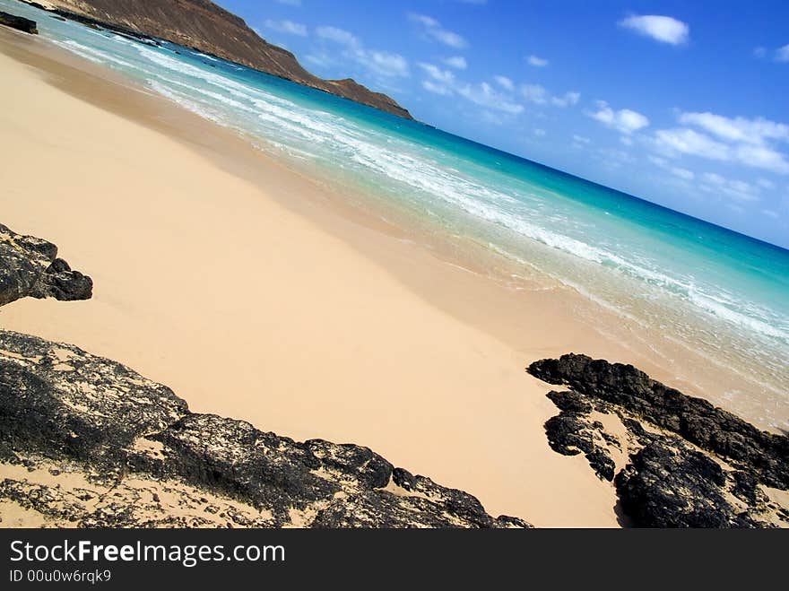 Photo of beach with rocks.