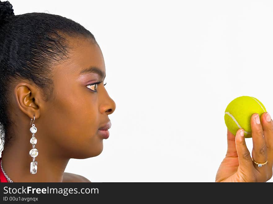 Young lady with a yellow tennis ball