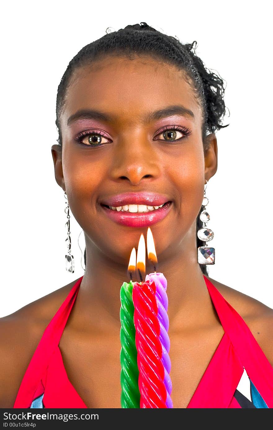 Beautiful young woman with three colored candles