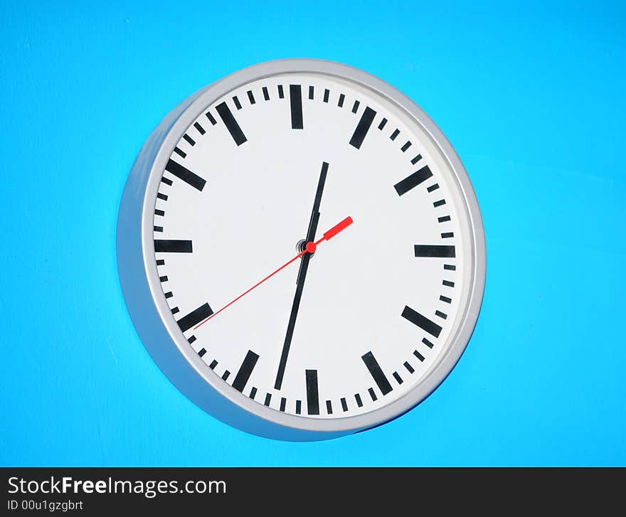 Clock On Blue Background