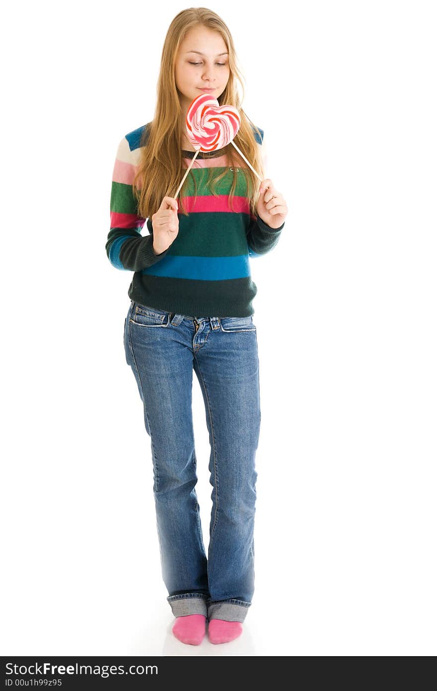 The girl with a sugar candy isolated on a white