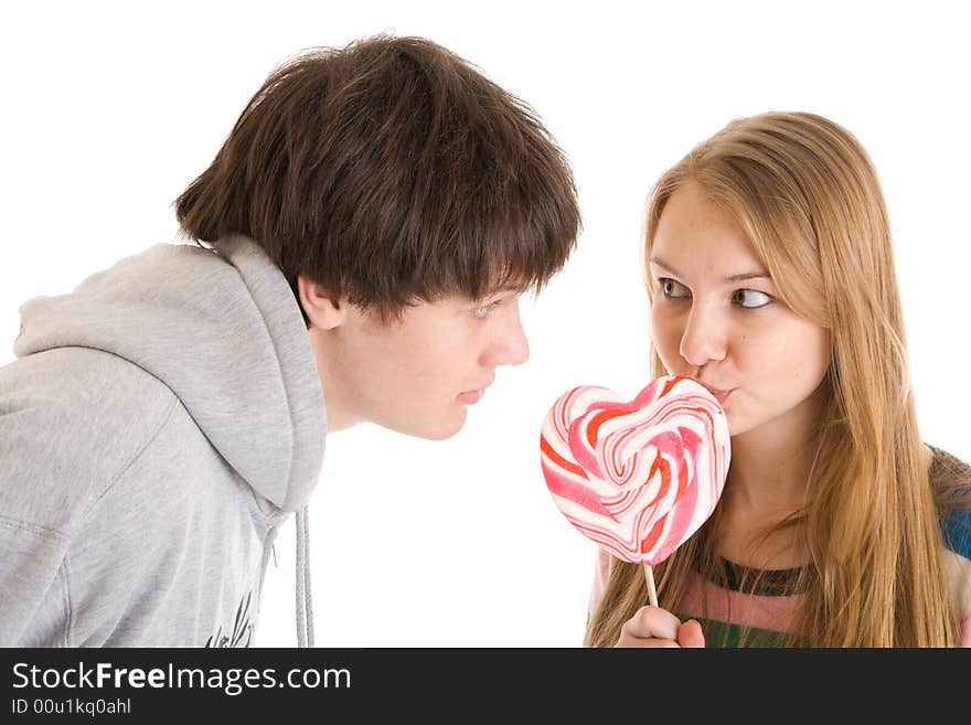 The Happy Young Couple Isolated On A White