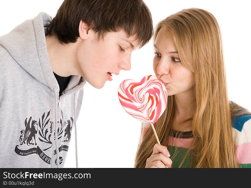 The happy young couple isolated on a white