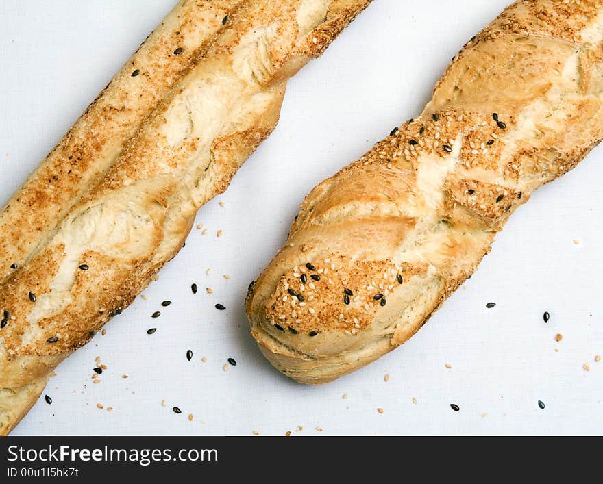 Two baguettes laying on a table