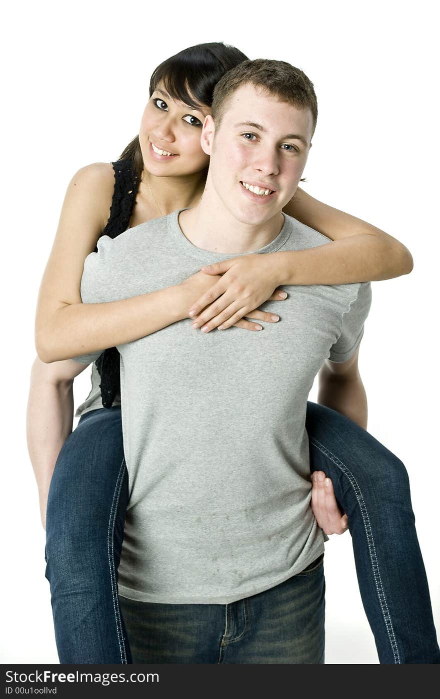 A young couple in love having a piggyback ride. A young couple in love having a piggyback ride