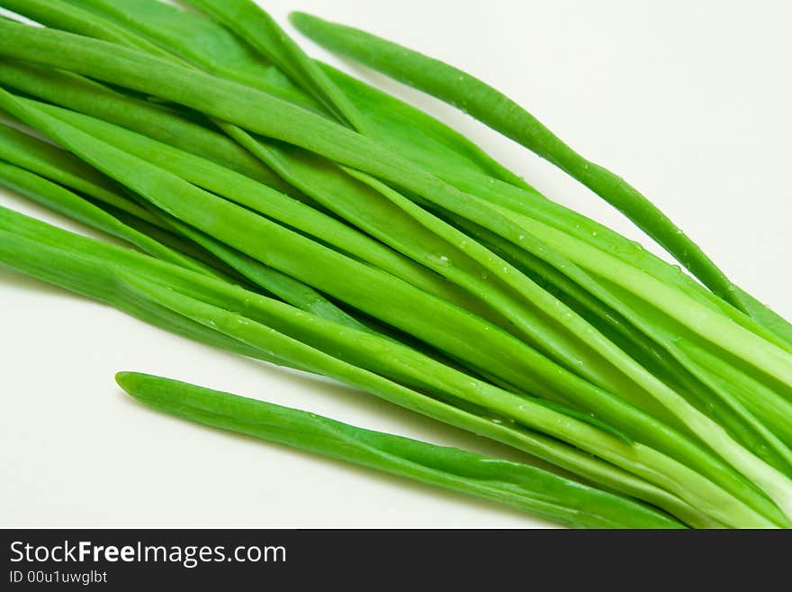 Green onions on a white background