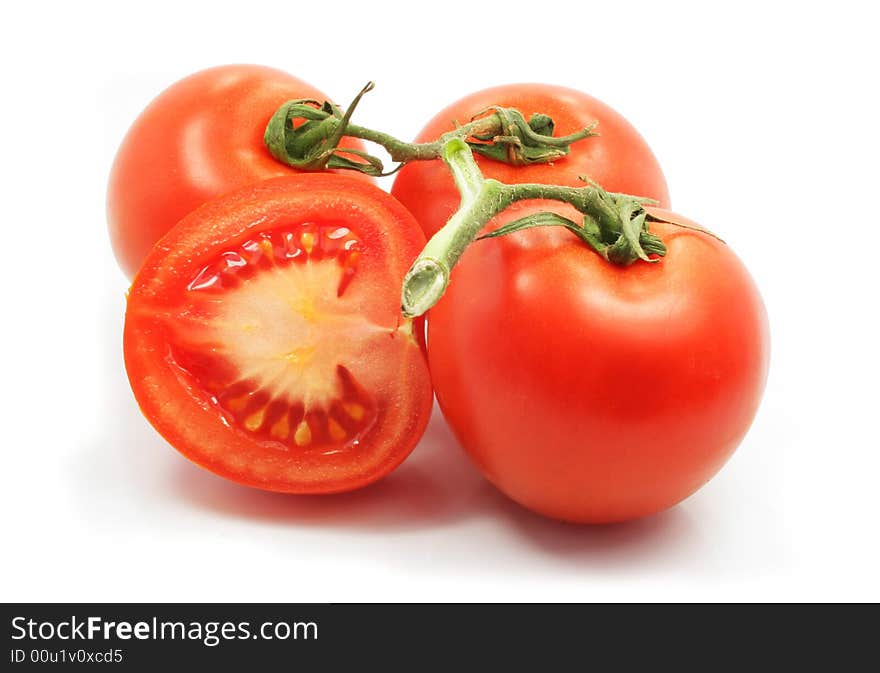 Fresh tomatoes with cut on white background