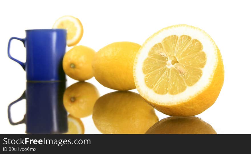 Diagonal shot of a lemons and blue mug