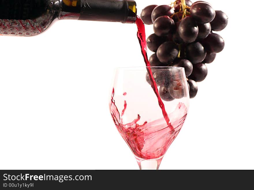 Red wine with a bottle on a withe background.