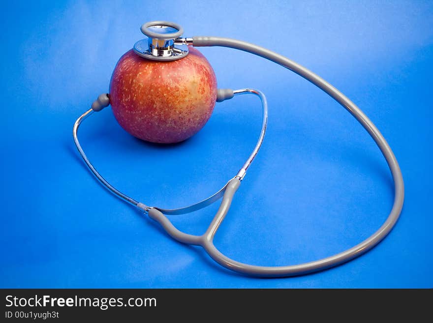 Red apple with stethotoscope