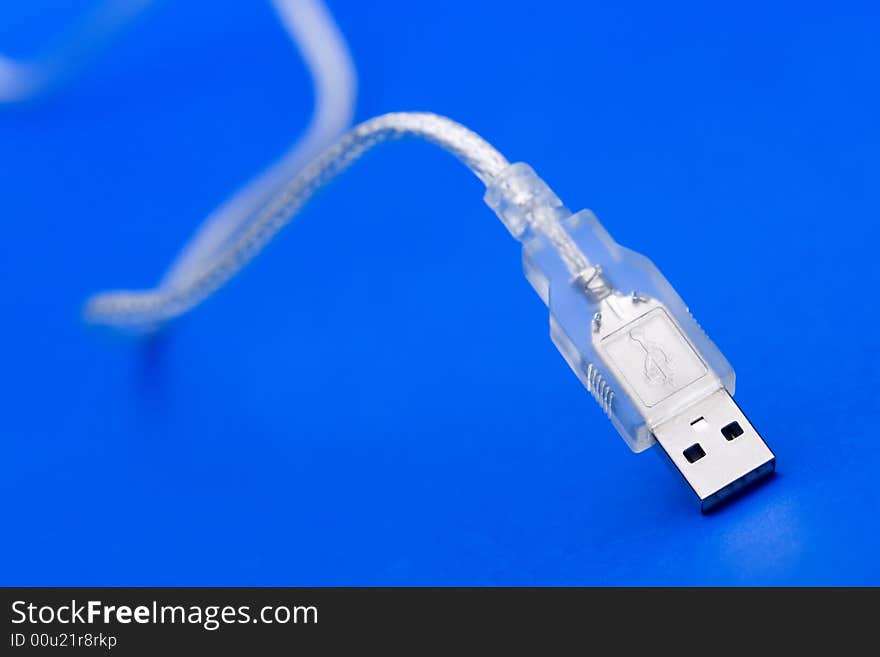 Transparent USB Cable against the blue background