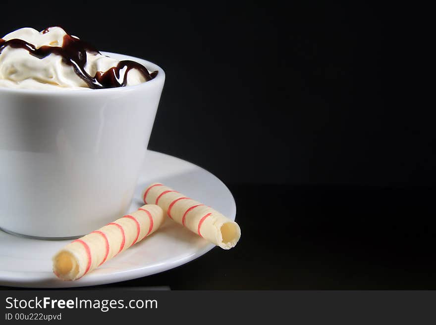 Macro shot of coffee with topping and chocolate. Macro shot of coffee with topping and chocolate