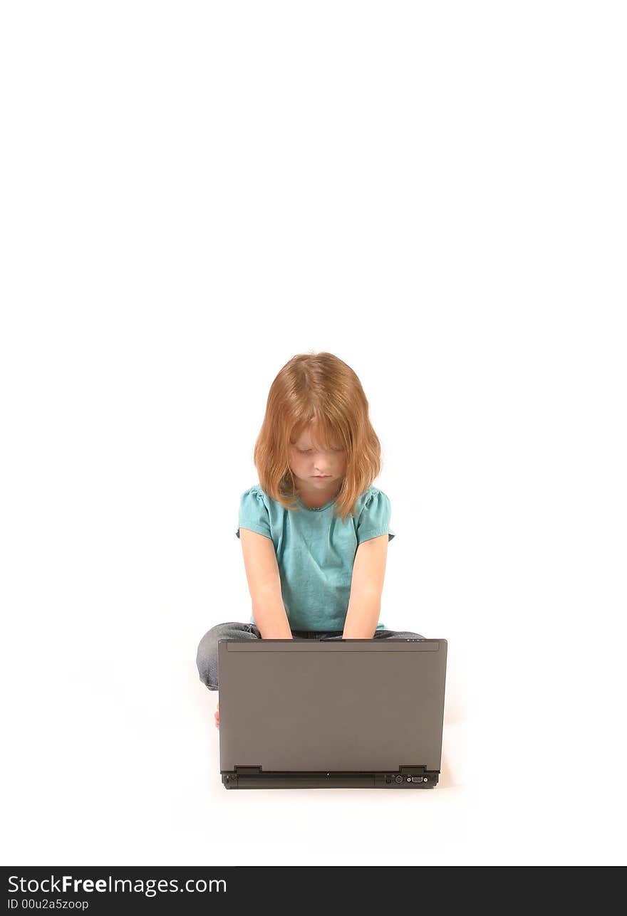 Isolated young girl using a laptop