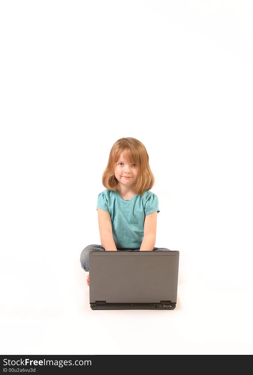 Isolated young girl using a laptop