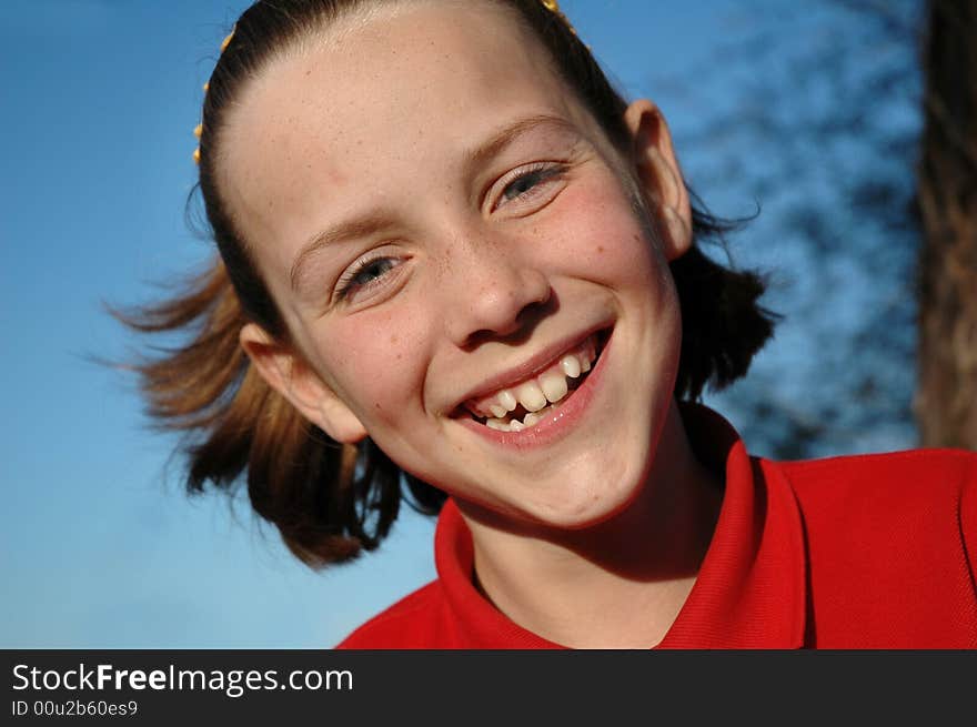 Close-up natural portrait of cheeky girl. Close-up natural portrait of cheeky girl