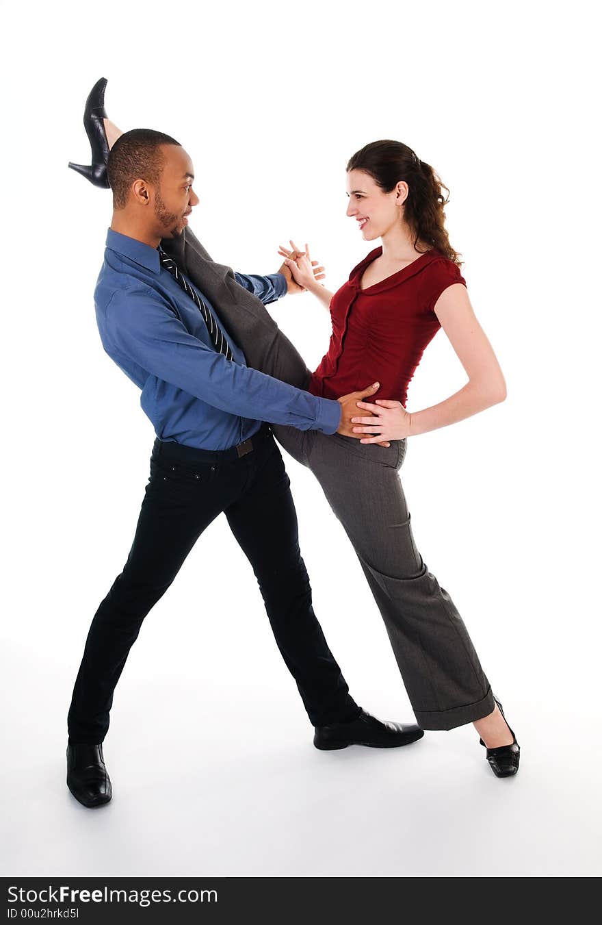 Young multi ethnic couple beautiful dancing on white. Young multi ethnic couple beautiful dancing on white