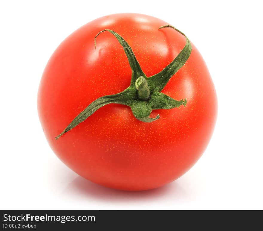 Fresh ripe tomato on white on white background