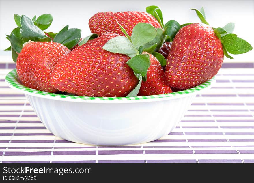 You have fresh strawberries in the bowl