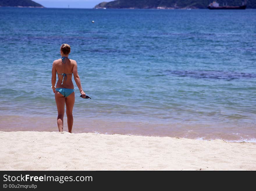 Young woman playing on the beach. Young woman playing on the beach