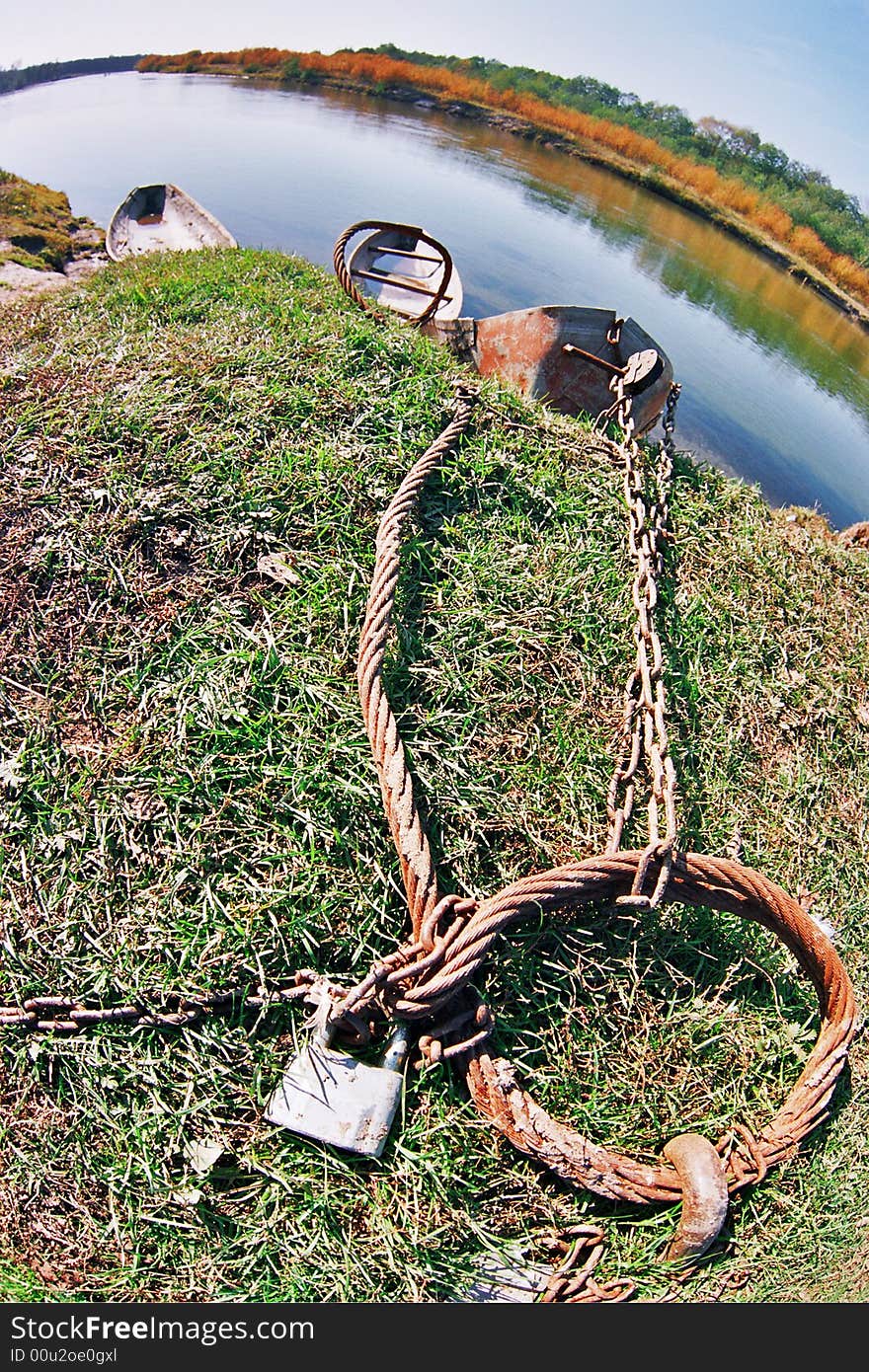 Three wooden boats adhered by a circuit on coast. Three wooden boats adhered by a circuit on coast