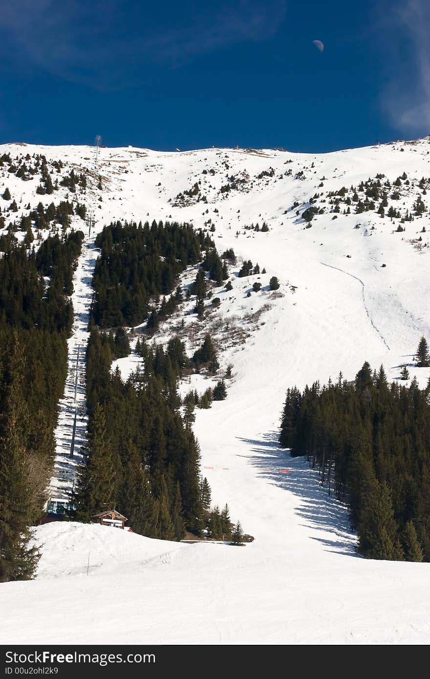 Red piste and chairlift in Meribel Valley, French Alps. Red piste and chairlift in Meribel Valley, French Alps