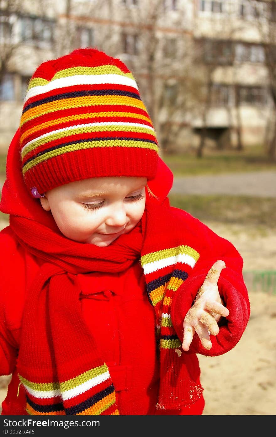 Little girl play with sand