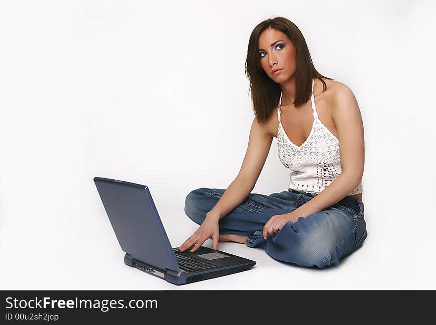 Brunette girl with laptop over white