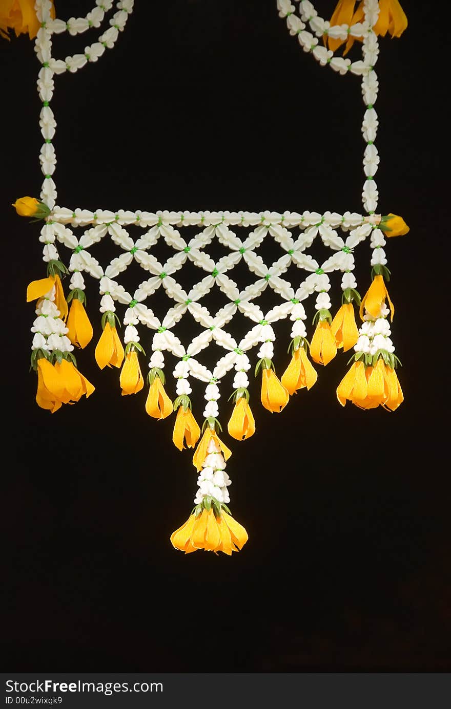 Buddhist flower offerings against black background