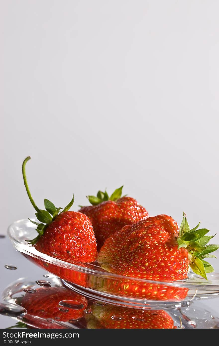 Food series: fresh ripe red strawberry on the plate