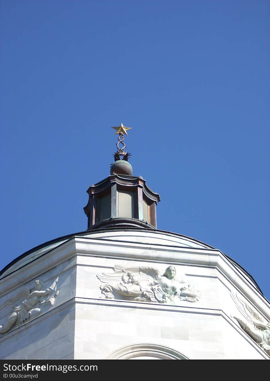 A part of an important monument in Milan under a blue sky. A part of an important monument in Milan under a blue sky