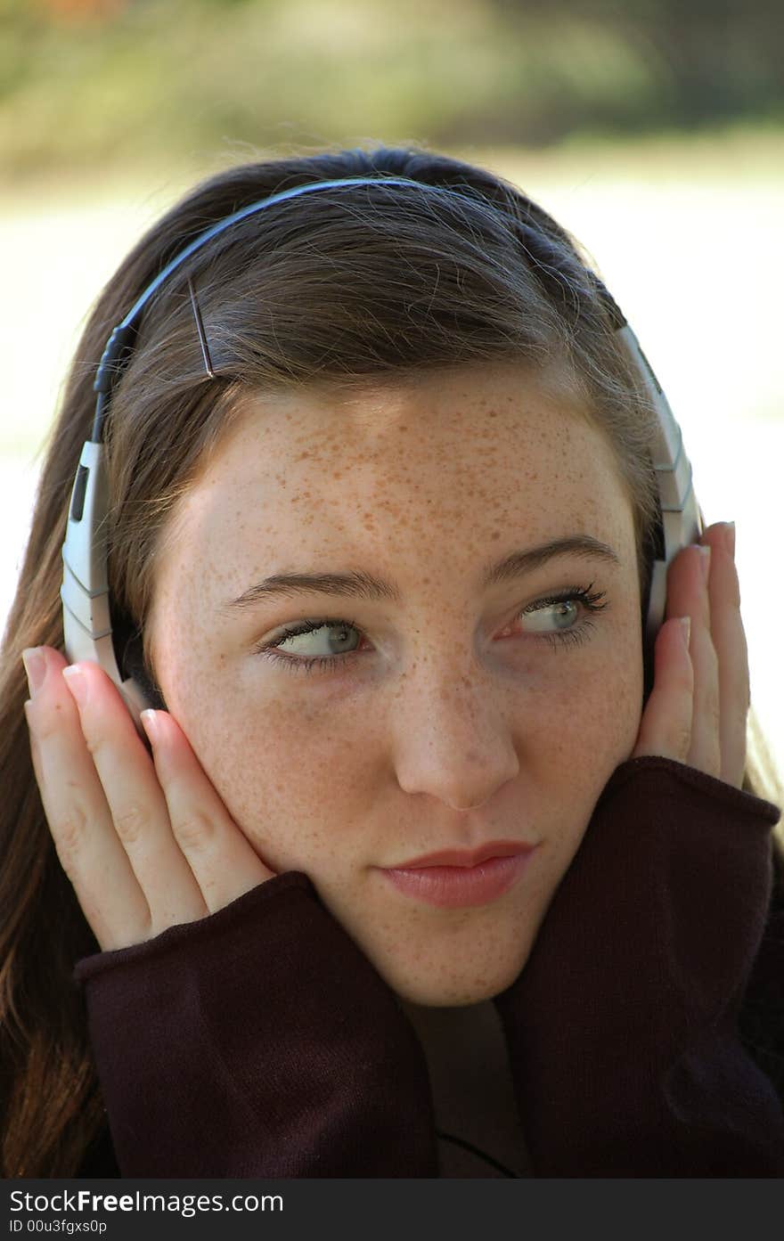 Pretty tween girl listening to music with headphones. Pretty tween girl listening to music with headphones