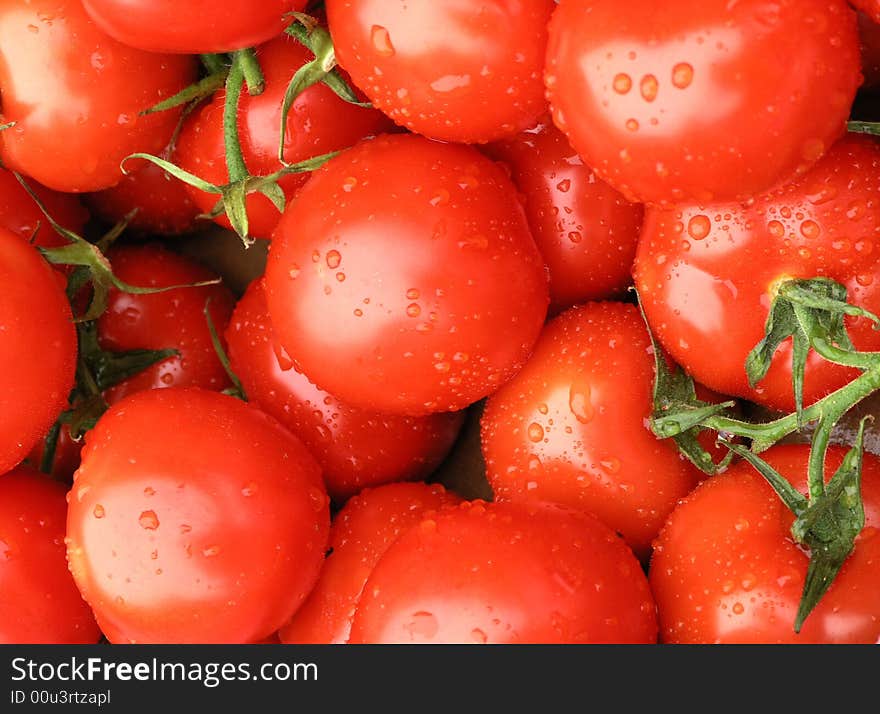 Tomatoes with water droplets on market stall. Tomatoes with water droplets on market stall