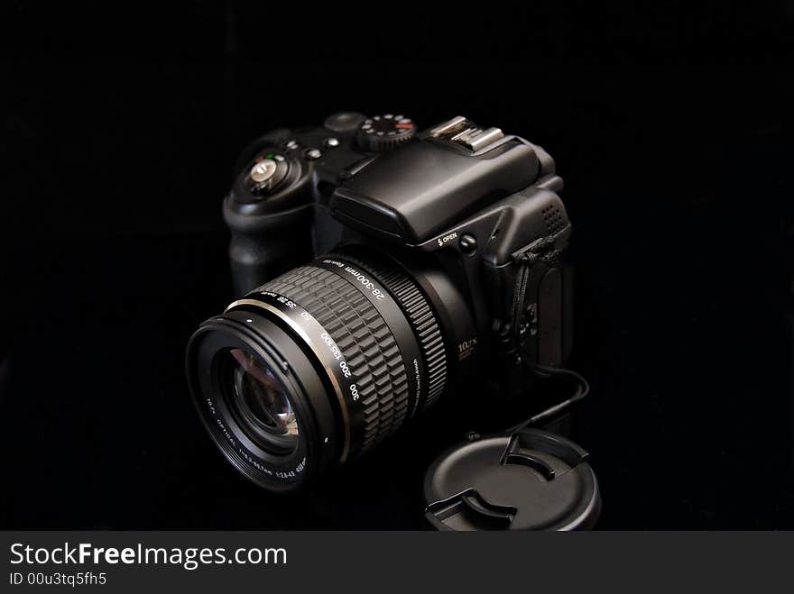 Modern profesionalny camera SLR on the black background