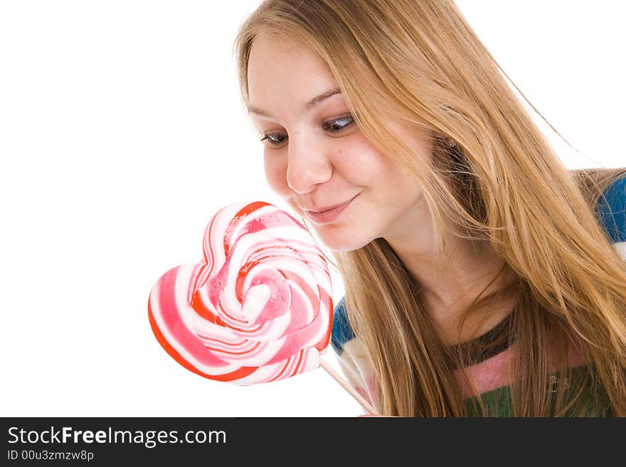 The girl with a sugar candy isolated on a white background