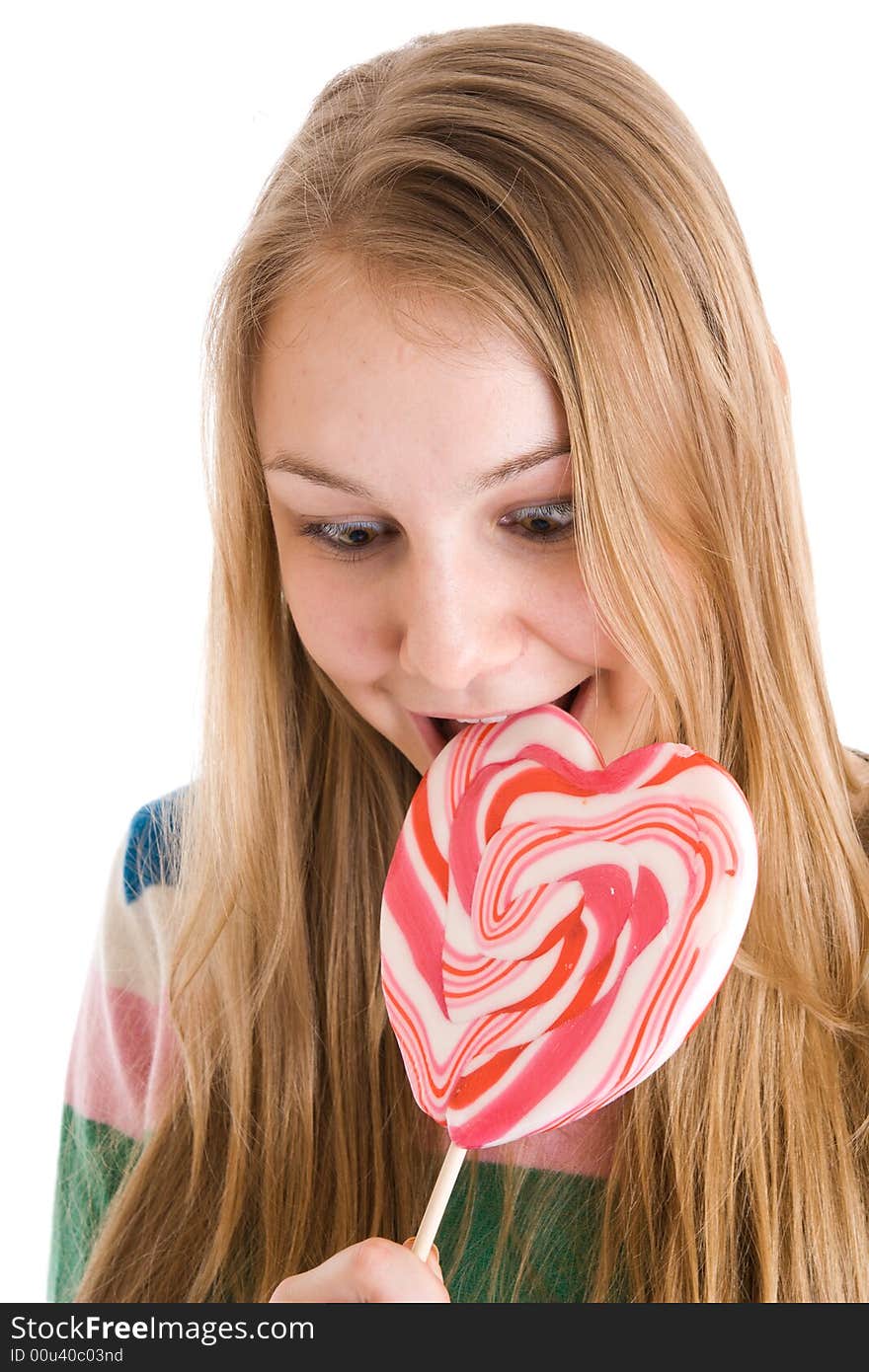 The girl with a sugar candy isolated on a white background