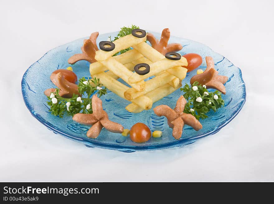 Funny potato chips arranged nicely on a plate for children to have fun.