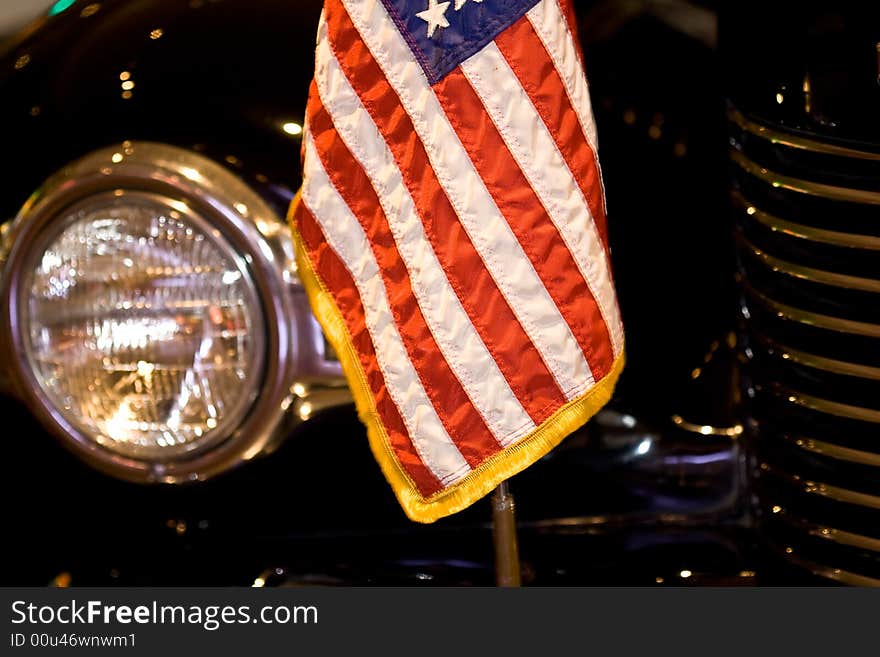 Us flag on the bumper of a black car. Us flag on the bumper of a black car