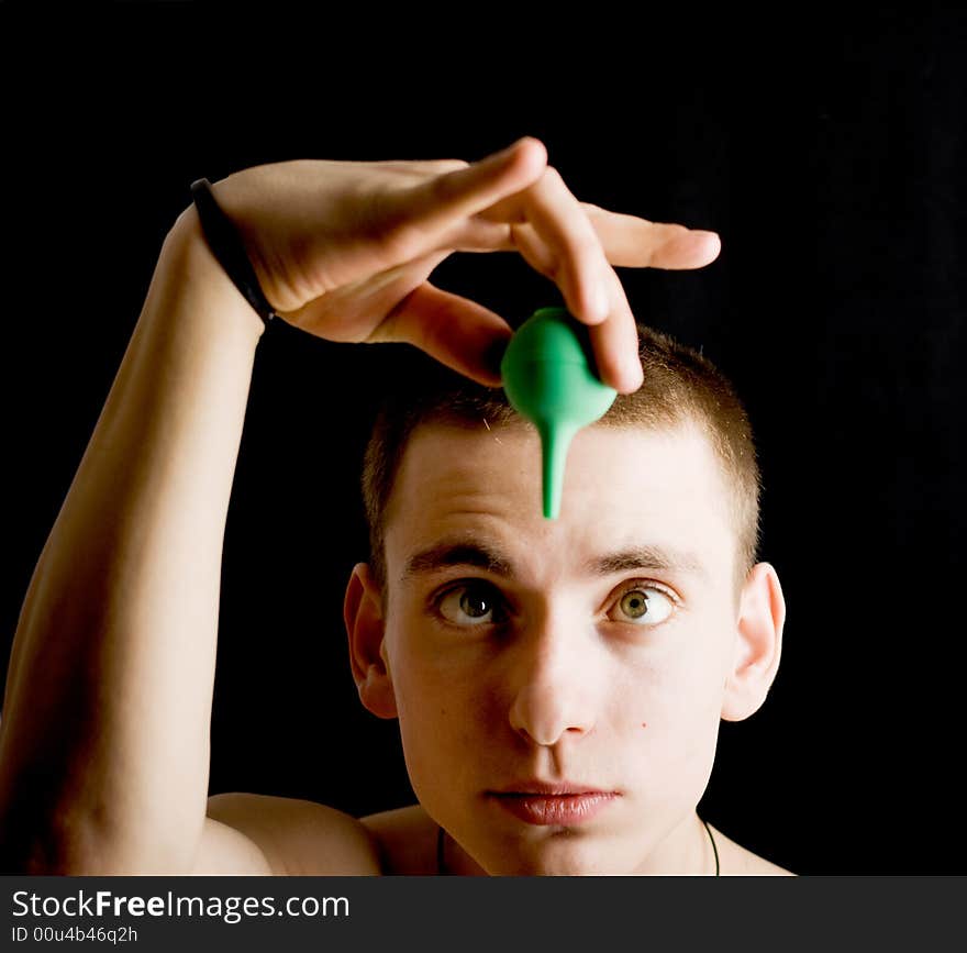 Naked man with medicine syringe