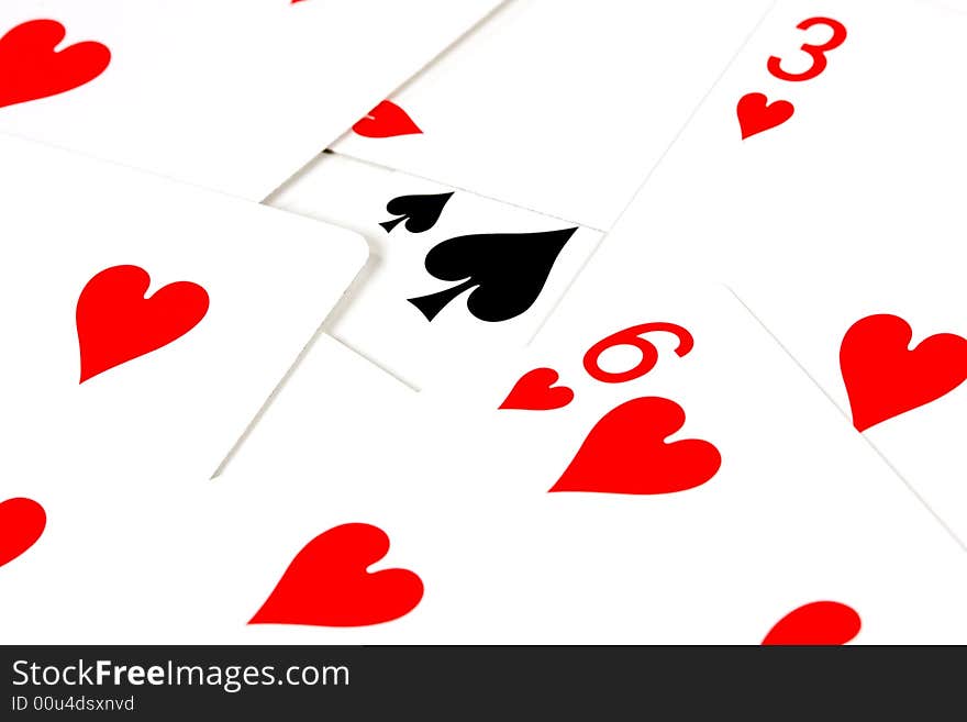 Playing cards with red hearts and one black heart. Playing cards with red hearts and one black heart