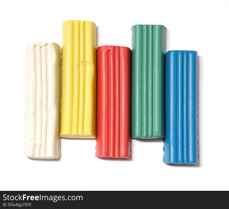 Five plasticine blocks on white background