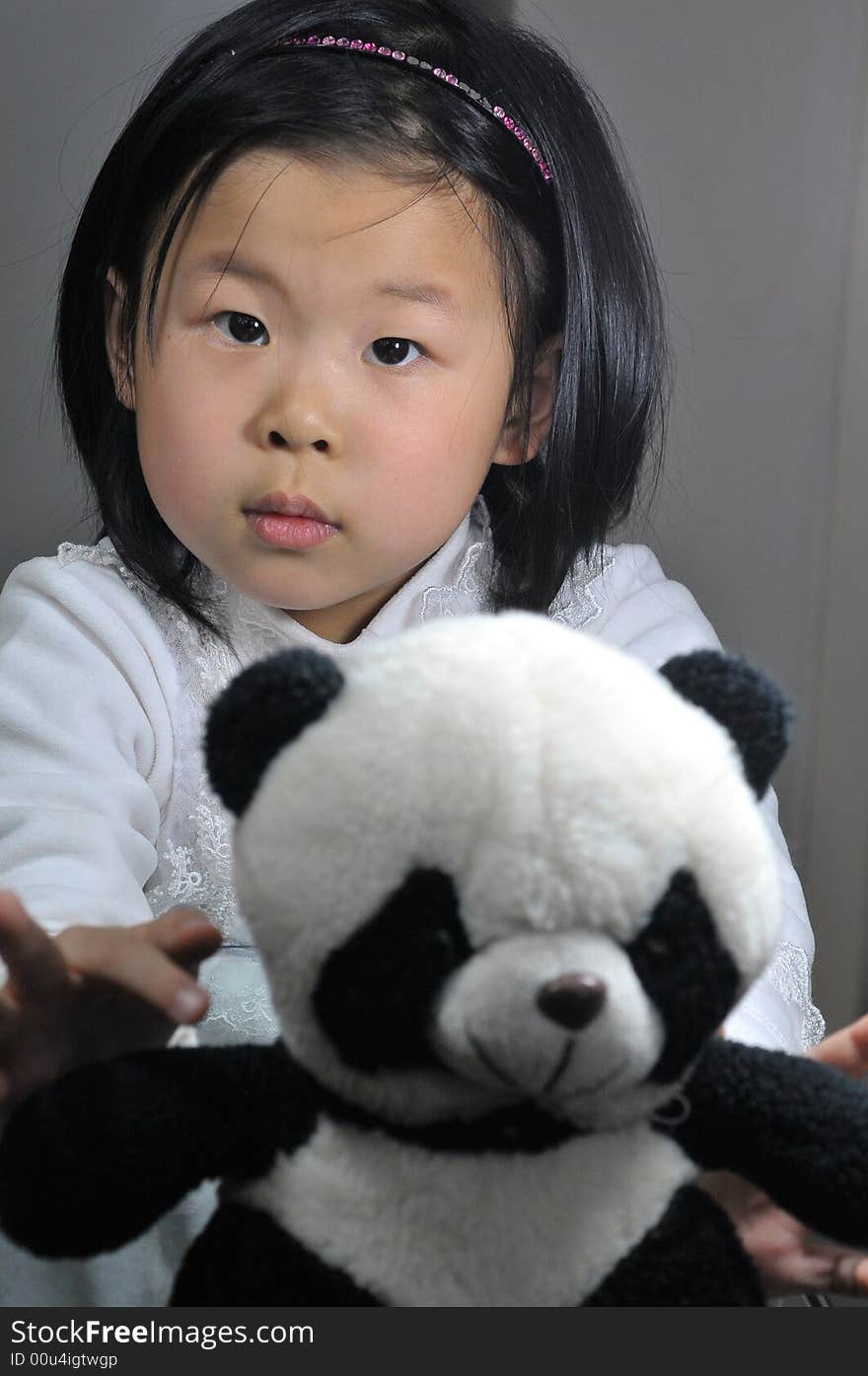 Girl with panda toys