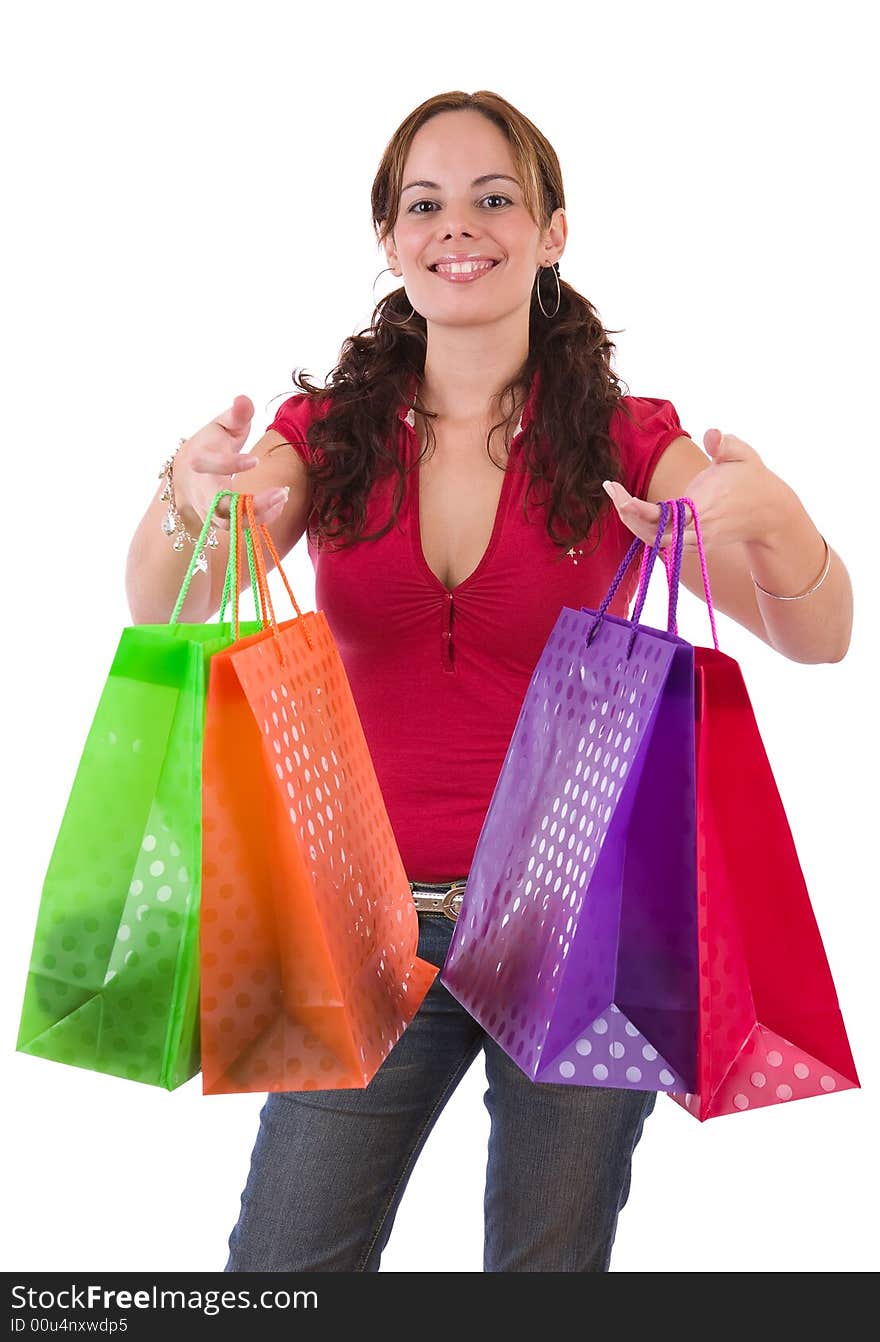 Young woman holding a few colorful shopping bags