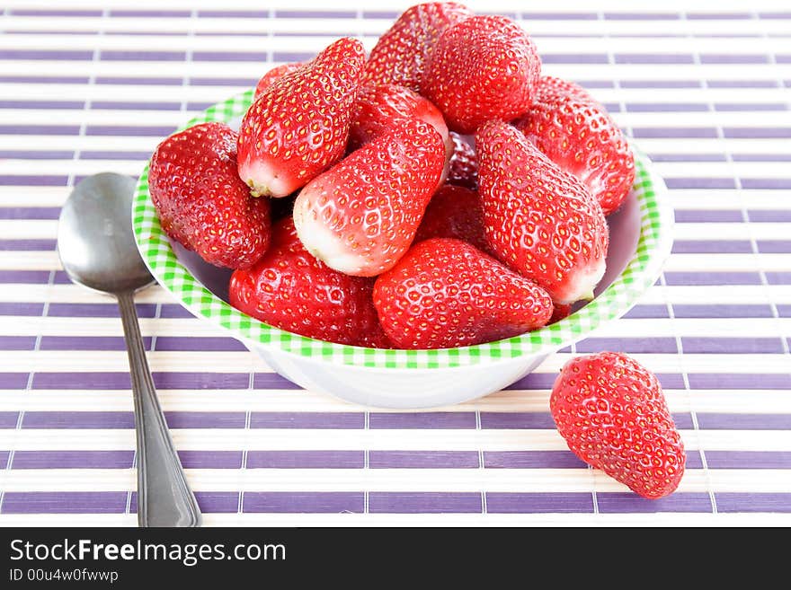 You have fresh strawberries in the bowl